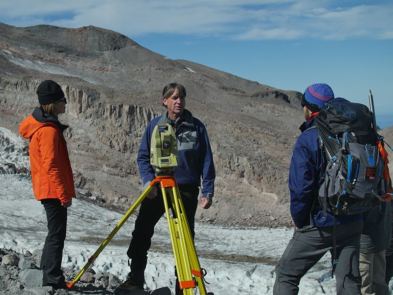 Faculty with students on a glacier